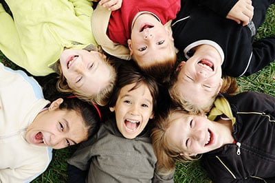 Happiness without limit, happy group of children in circle, together outdoor, faces, smiling and careless